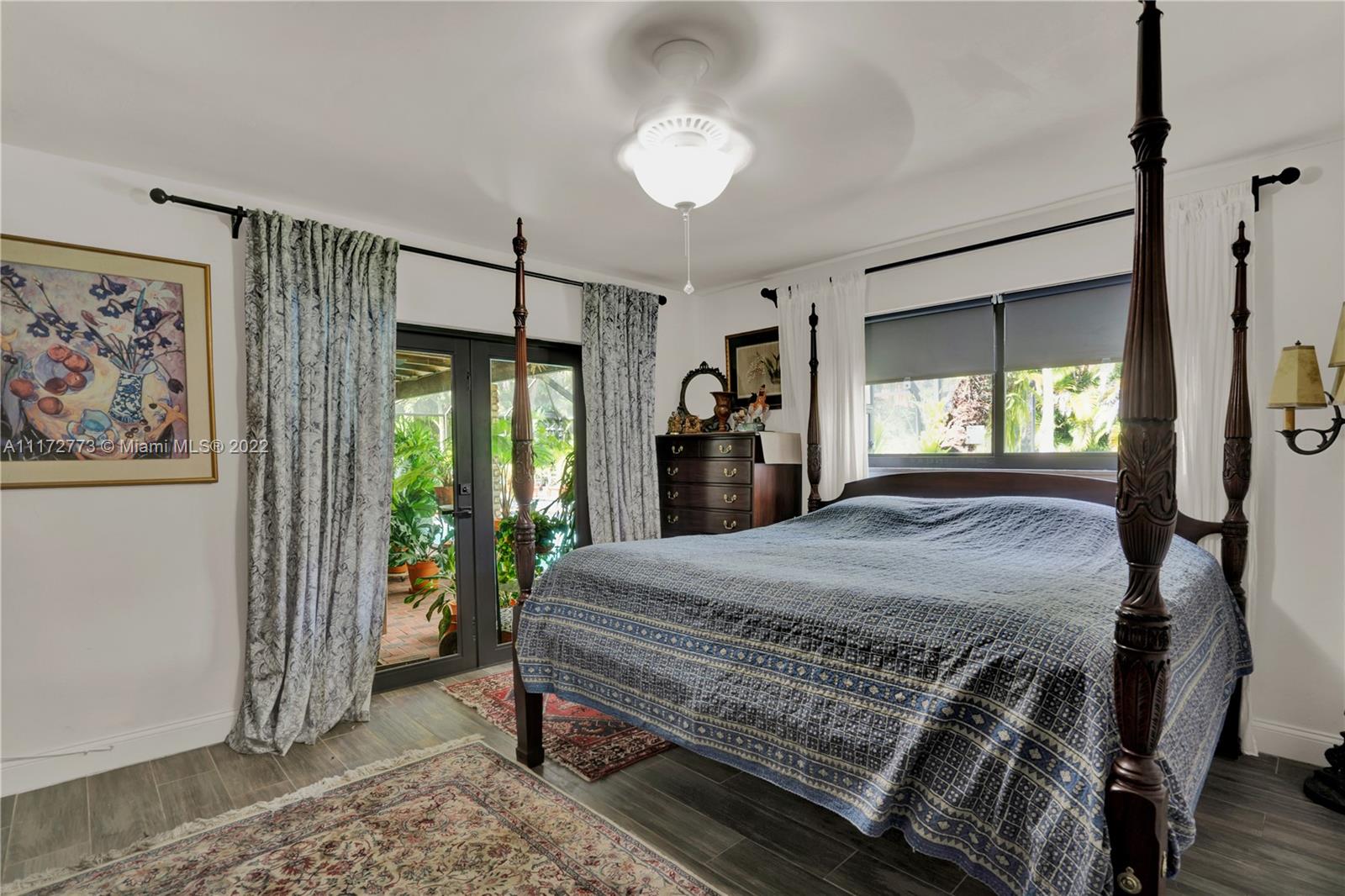 8695 Southwest 110th Street Miami, FL 33156 - Photo 48 of 54 a bed sitting in a spacious bedroom next to a window