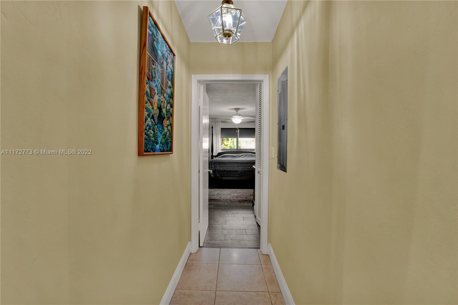 8695 Southwest 110th Street Miami, FL 33156 - Photo 53 of 54 a view of a hallway view with wooden floor and staircase