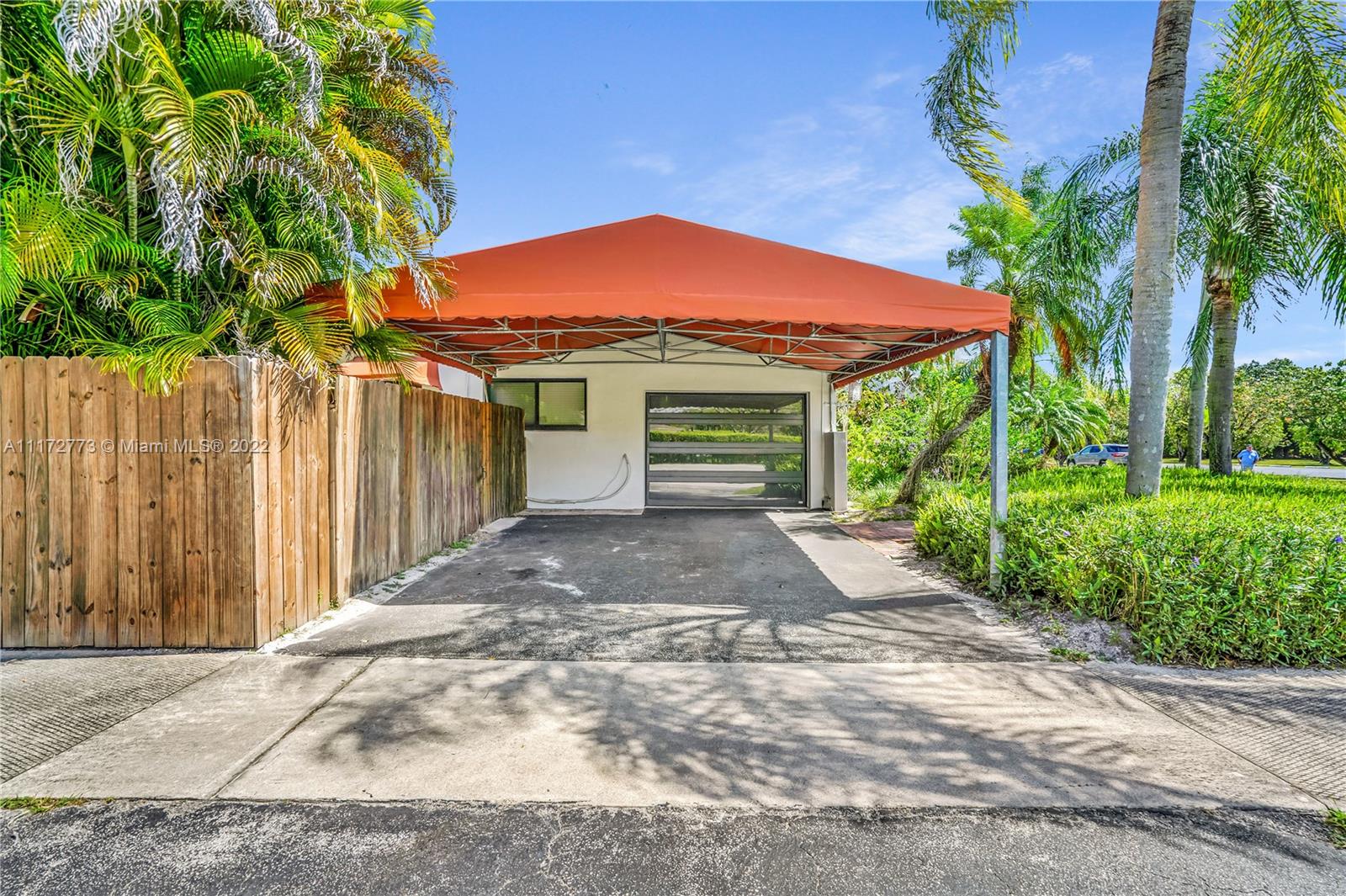 8695 Southwest 110th Street Miami, FL 33156 - Photo 7 of 54 a front view of house with yard and trees