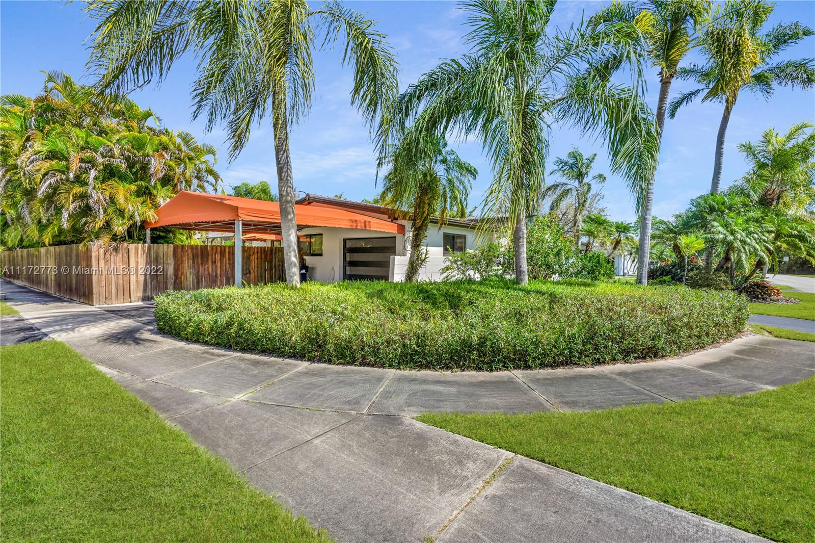 8695 Southwest 110th Street Miami, FL 33156 - Photo 9 of 54 a view of a backyard with a garden
