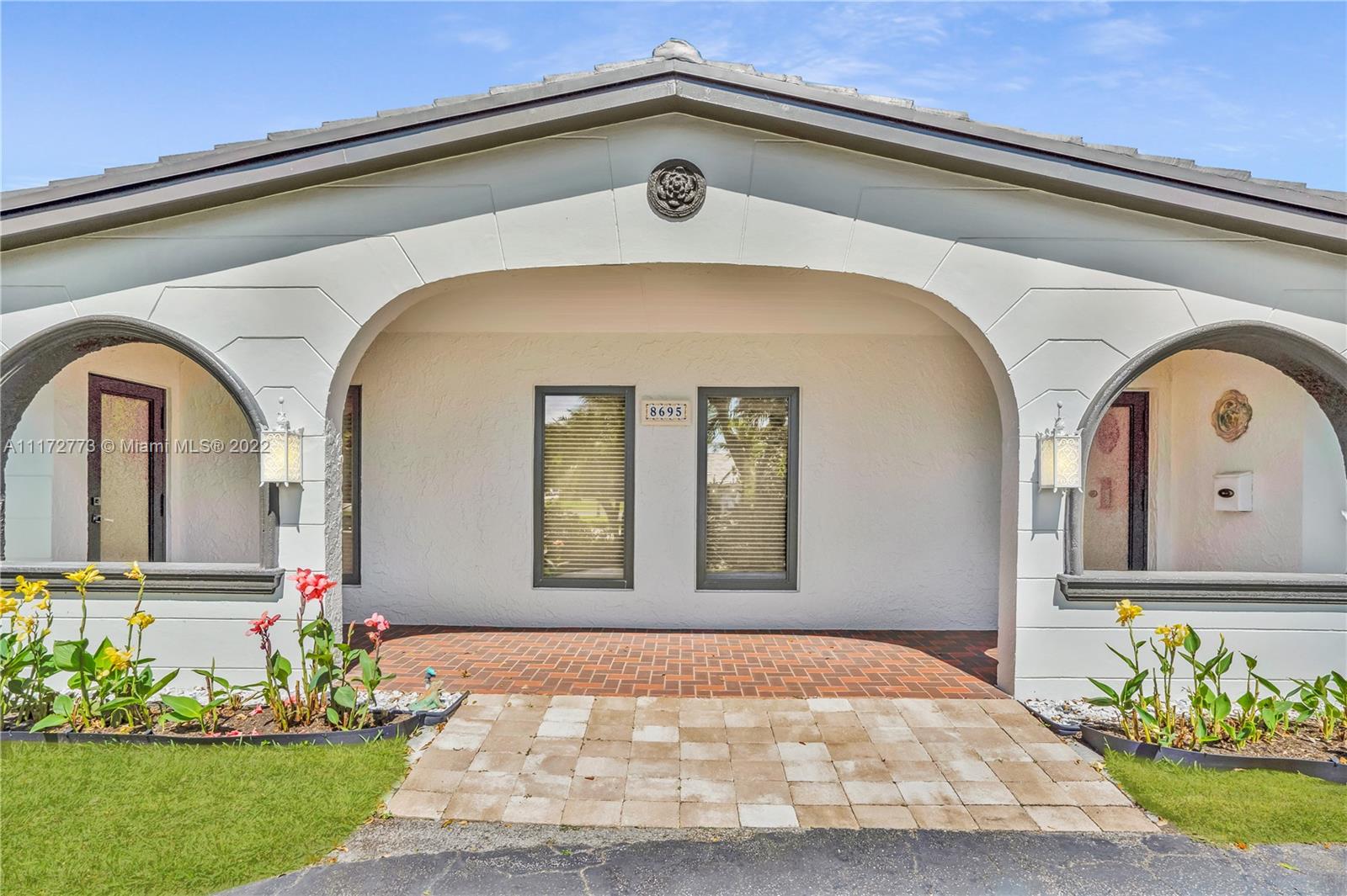 8695 Southwest 110th Street Miami, FL 33156 - Photo 10 of 54 a front view of a house