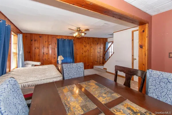 a bedroom with furniture and wooden floor