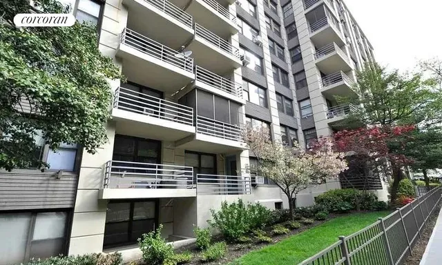 a view of a building with potted plants