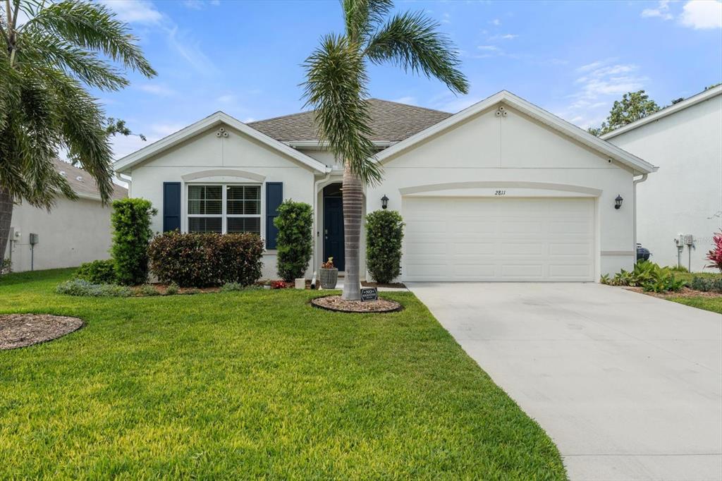 2811 Greenleaf Terrace Parrish, FL 34219 - Photo 1 of 1 a front view of house with yard and green space