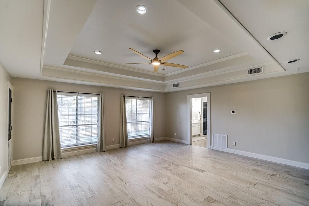 2045 Mansfield Road Cedar Hill, TX 75104 - Photo 11 of 32 a view of an empty room with window and wooden floor