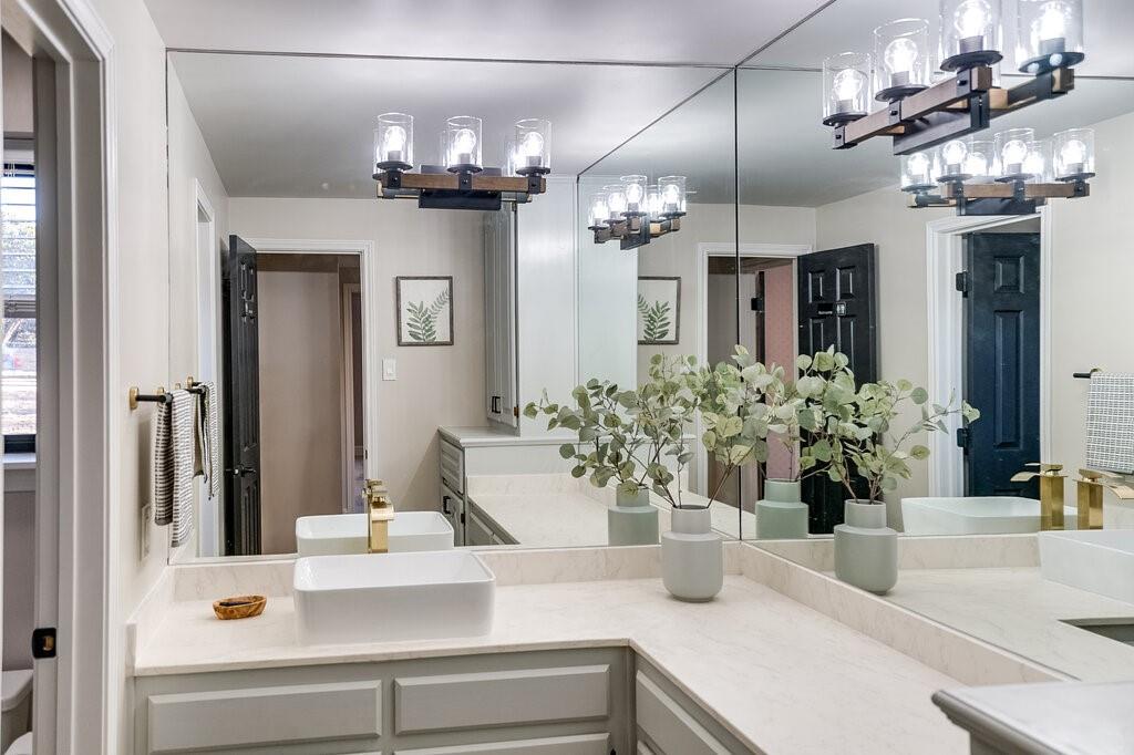2045 Mansfield Road Cedar Hill, TX 75104 - Photo 15 of 32 a view of a dining room with a chandelier
