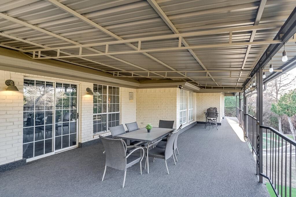 2045 Mansfield Road Cedar Hill, TX 75104 - Photo 17 of 32 a view of a patio with table and chairs