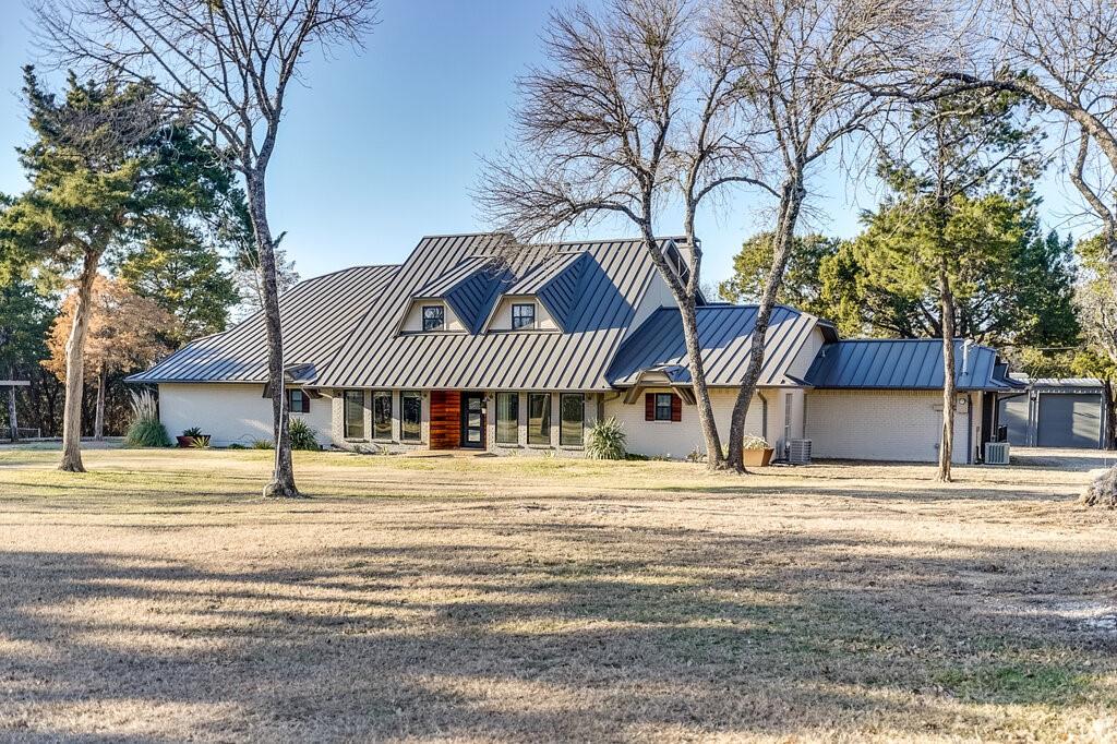 2045 Mansfield Road Cedar Hill, TX 75104 - Photo 22 of 32 a house with trees in front of it