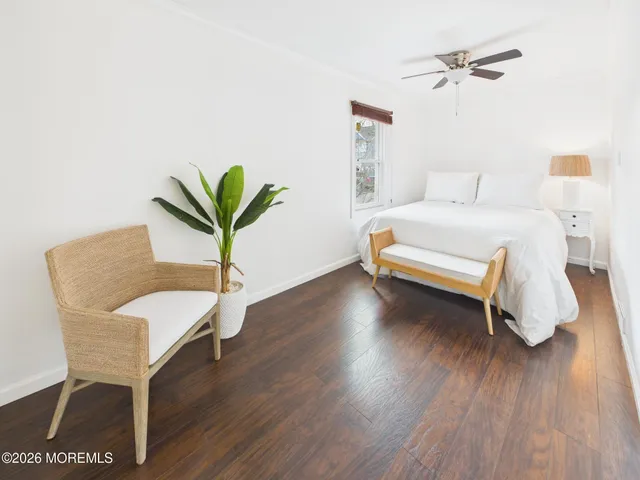 a bedroom with a bed and a chair