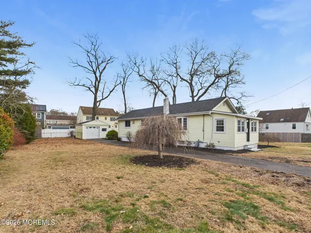 a house that has a tree in front of it