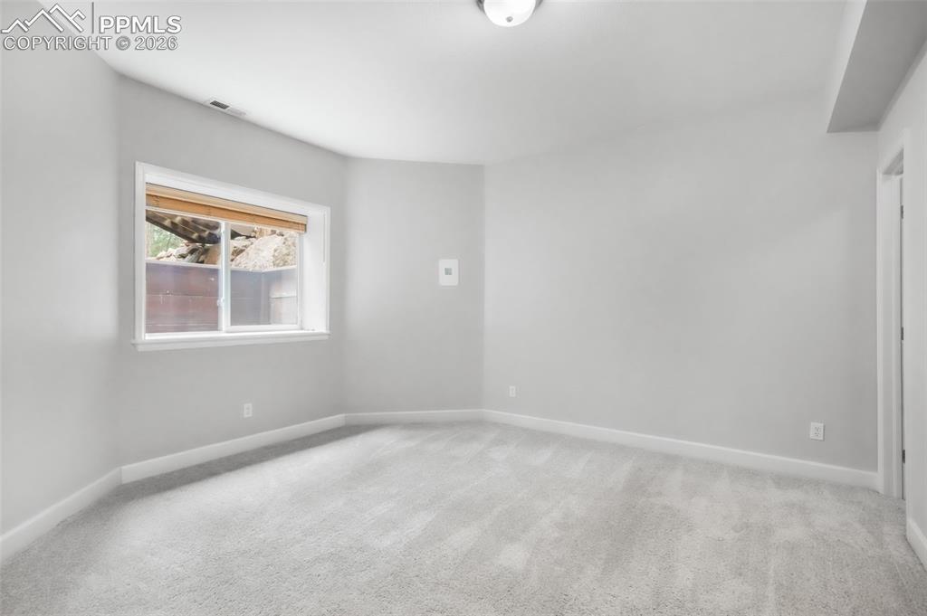 19010 Deerfield Road Monument, CO 80132 - Photo 41 of 50 an empty room with a window
