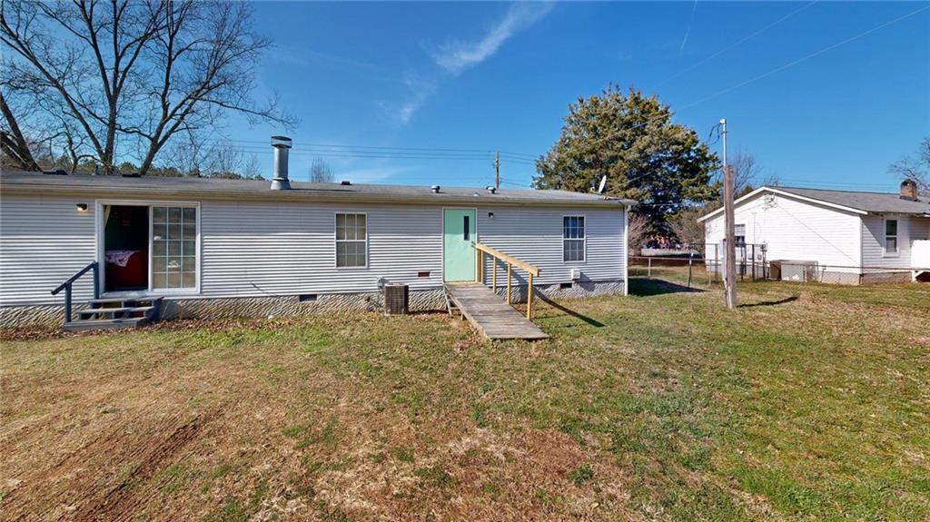189 Boyd Valley Road Southeast Rome, GA 30161 - Photo 14 of 28 a view of a house with a yard and large tree