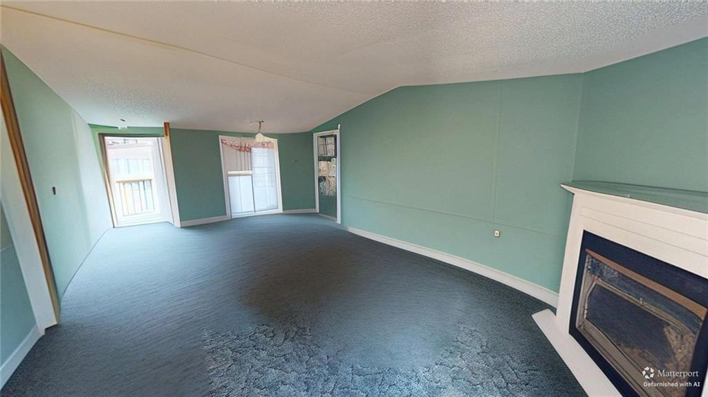 189 Boyd Valley Road Southeast Rome, GA 30161 - Photo 18 of 28 a view of an empty room with a fireplace and a window
