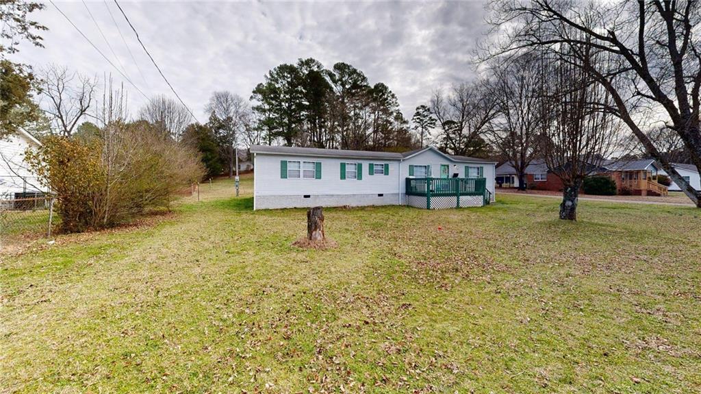 189 Boyd Valley Road Southeast Rome, GA 30161 - Photo 2 of 28 a house view with a garden space