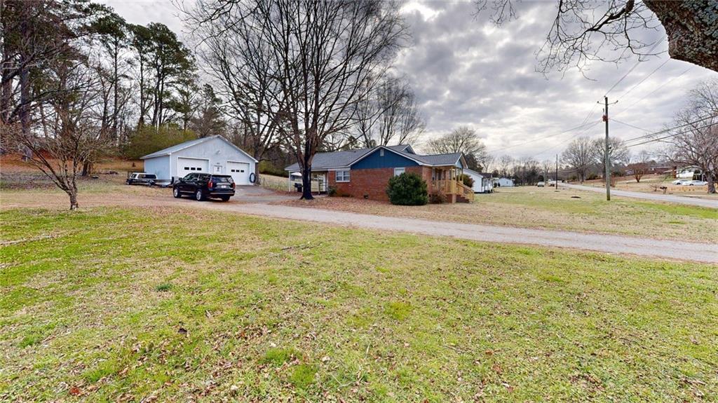 189 Boyd Valley Road Southeast Rome, GA 30161 - Photo 8 of 28 a view of a house with a big yard and large trees