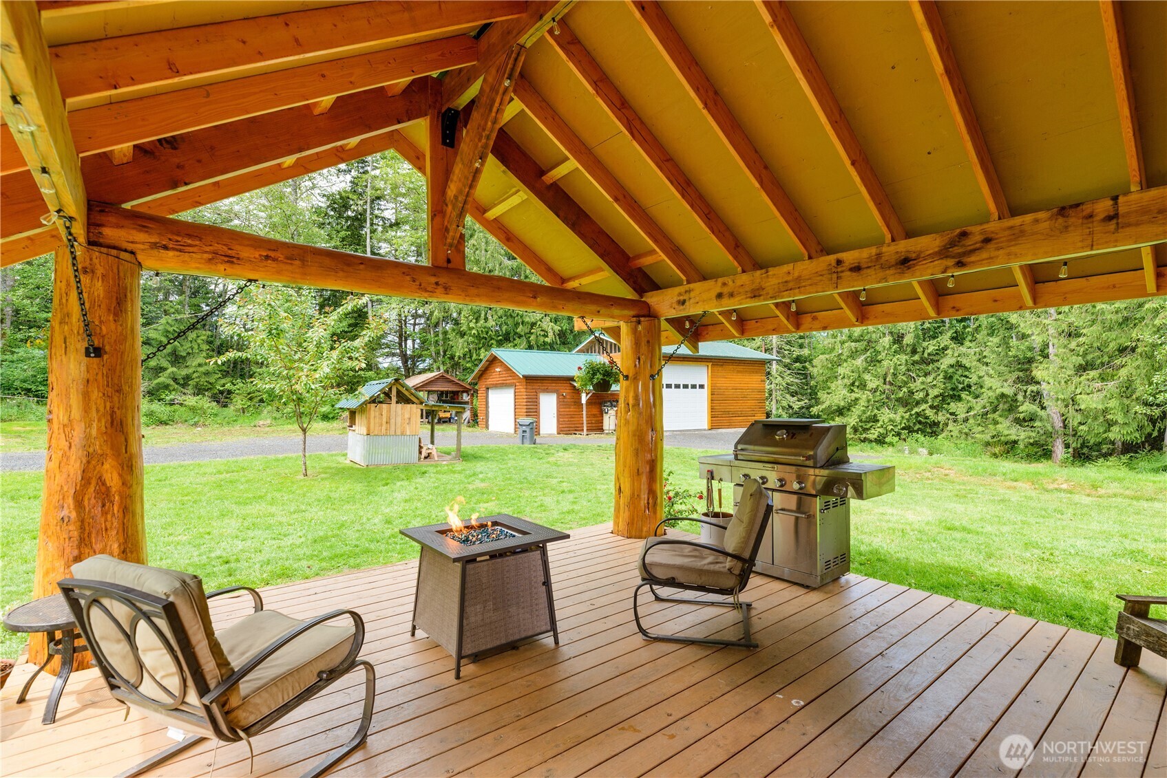 134 Bishop Road Port Angeles, WA 98363 - Photo 16 of 38 a view of chairs and yard with wooden floor and roof