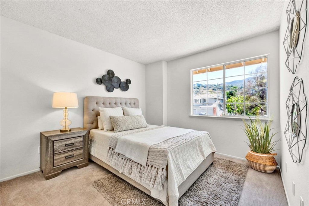 3031 Mountainside Drive Corona, CA 92882 - Photo 13 of 18 a bedroom with a bed and a window