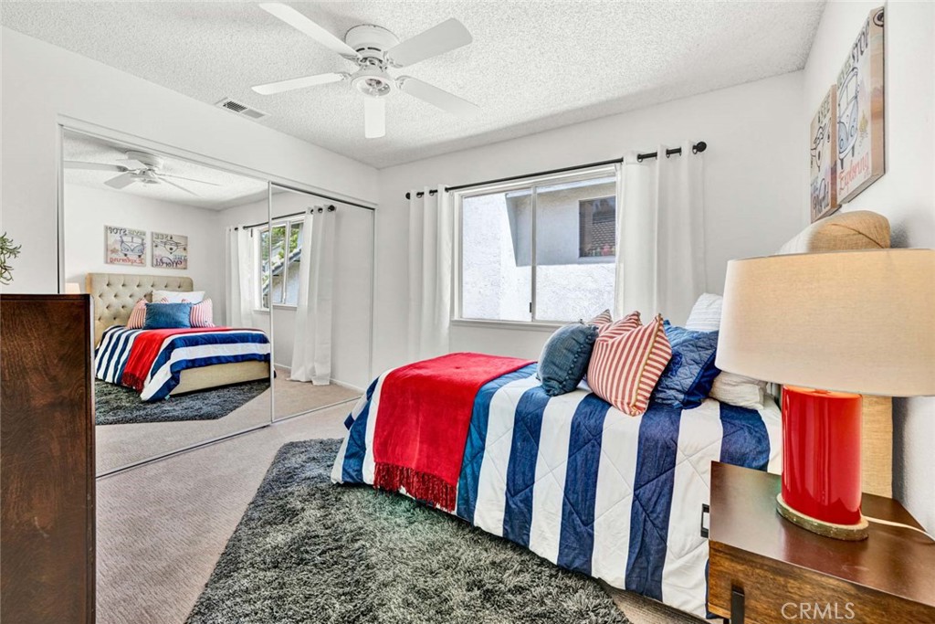 3031 Mountainside Drive Corona, CA 92882 - Photo 15 of 18 a bedroom with a bed and window