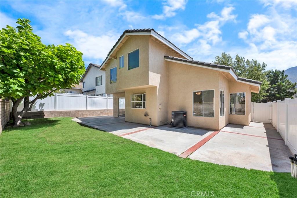 3031 Mountainside Drive Corona, CA 92882 - Photo 16 of 18 a front view of a house with a yard and trees