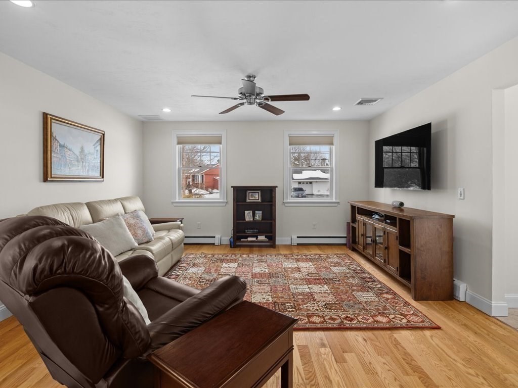 7 Pierce Road Marshfield, MA 02050 - Photo 20 of 34 a living room with furniture and a flat screen tv