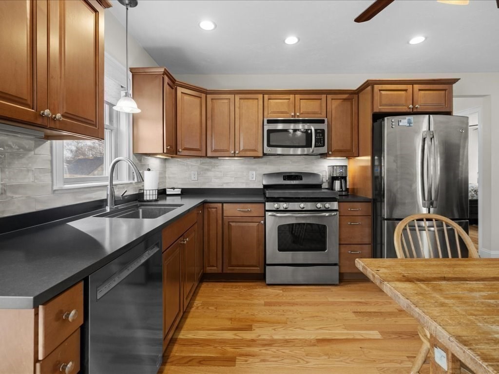 7 Pierce Road Marshfield, MA 02050 - Photo 22 of 34 a kitchen with stainless steel appliances a sink a stove a microwave and a refrigerator
