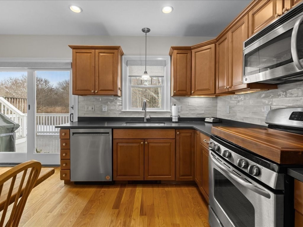 7 Pierce Road Marshfield, MA 02050 - Photo 23 of 34 a kitchen with granite countertop wooden cabinets stainless steel appliances and a sink