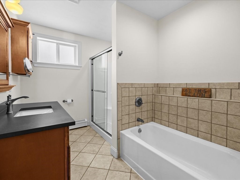 7 Pierce Road Marshfield, MA 02050 - Photo 27 of 34 a bathroom with a bathtub sink and vanity