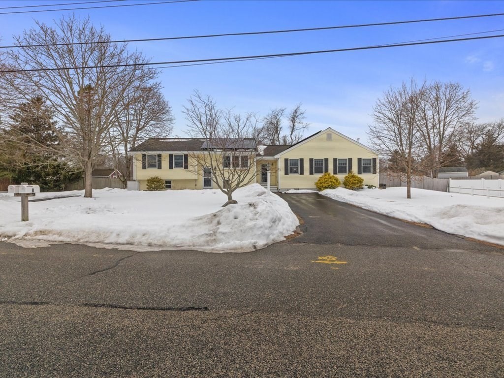 7 Pierce Road Marshfield, MA 02050 - Photo 3 of 34 a front view of a house with a yard covered in snow