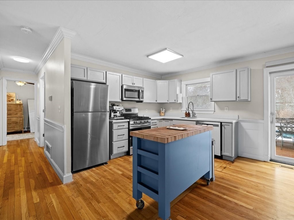 7 Pierce Road Marshfield, MA 02050 - Photo 8 of 34 a kitchen with stainless steel appliances granite countertop a refrigerator and a stove top oven
