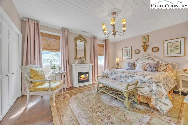 a living room with furniture a dining table and a fireplace