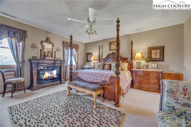 a large bathroom with a sink a mirror and a bathtub