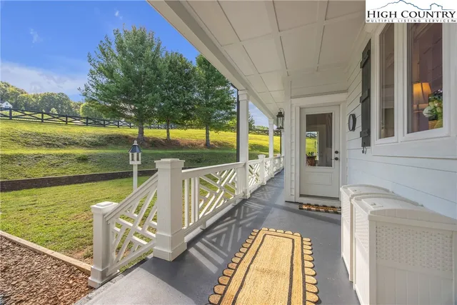 a view of a house with backyard and deck