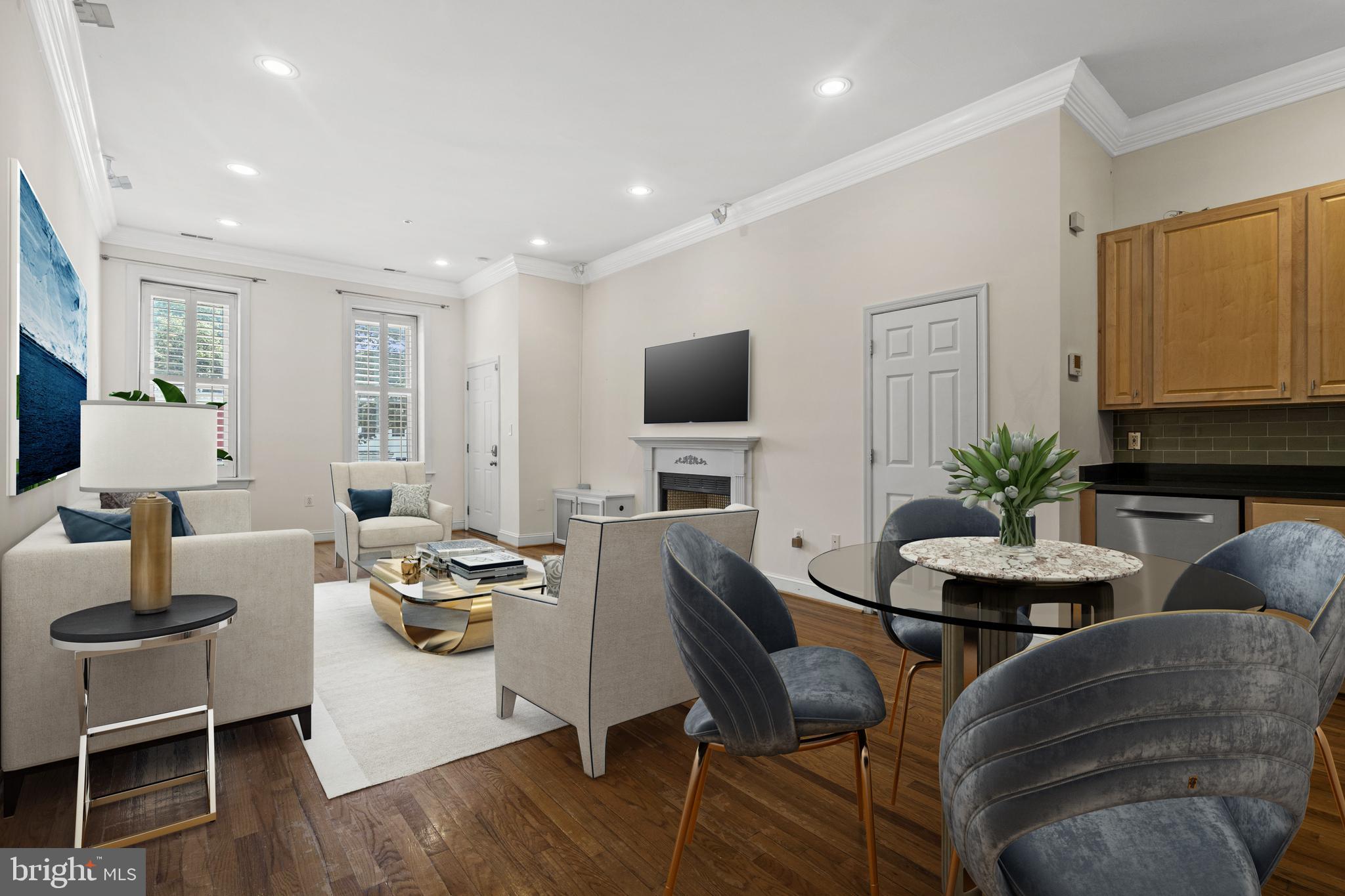 1426 11th Street Northwest, Unit 2 Washington, DC 20001 - Photo 1 of 27 a living room with furniture a flat screen tv and a dining table
