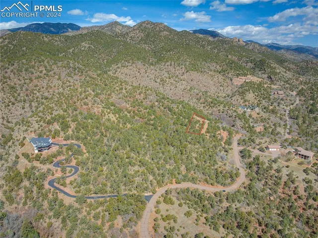 a view of a field with an ocean