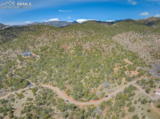 a view of a field with an ocean
