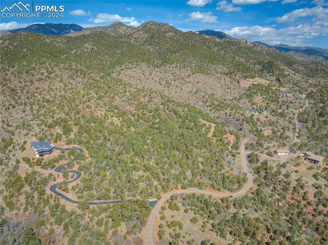 a view of a field with an ocean