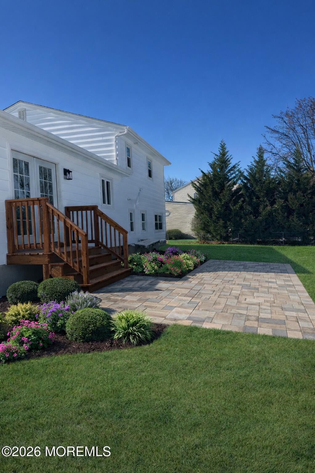 568 Flock Road Hamilton Square, NJ 08690 - Photo 11 of 65 a view of backyard with potted plants and wooden fence
