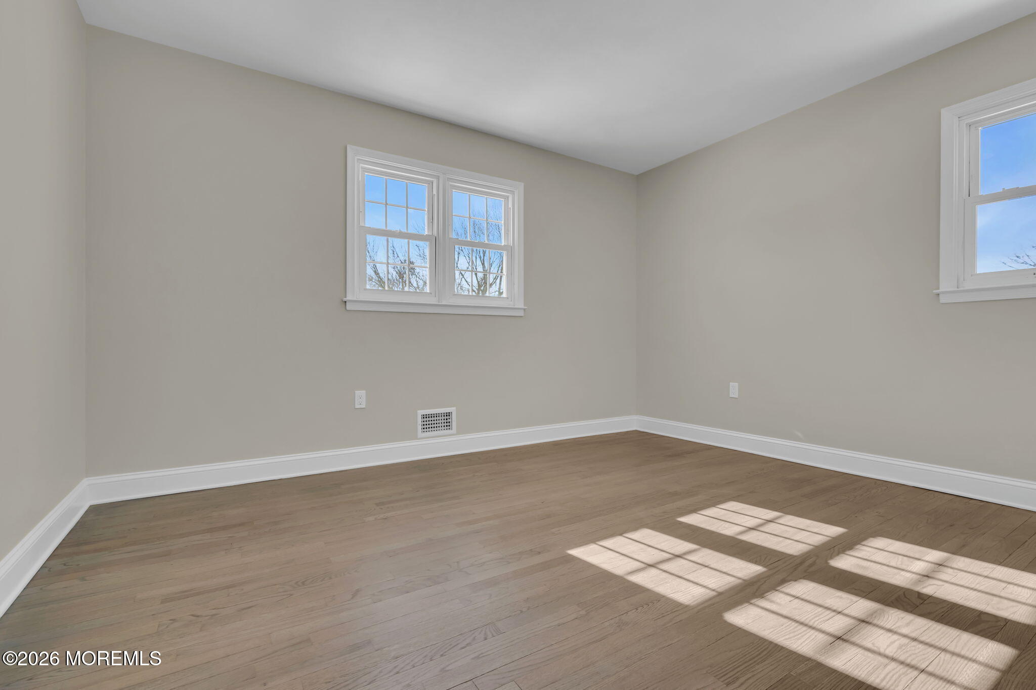 568 Flock Road Hamilton Square, NJ 08690 - Photo 48 of 65 an empty room with wooden floor and windows