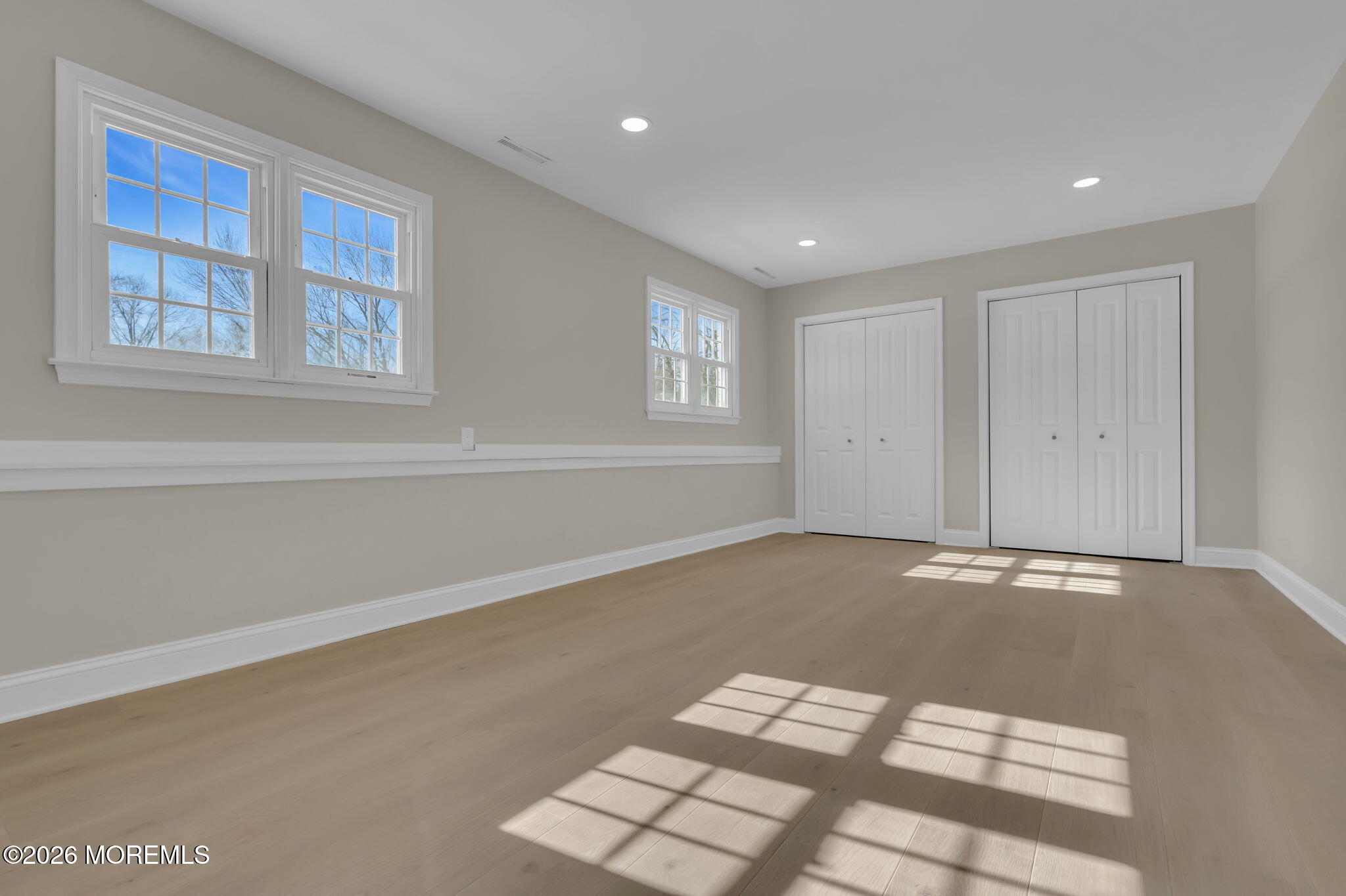 568 Flock Road Hamilton Square, NJ 08690 - Photo 5 of 65 a view of an empty room with a window