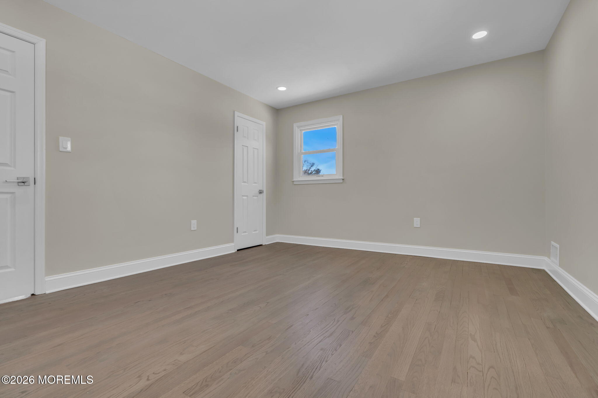 568 Flock Road Hamilton Square, NJ 08690 - Photo 51 of 65 a view of an empty room with wooden floor