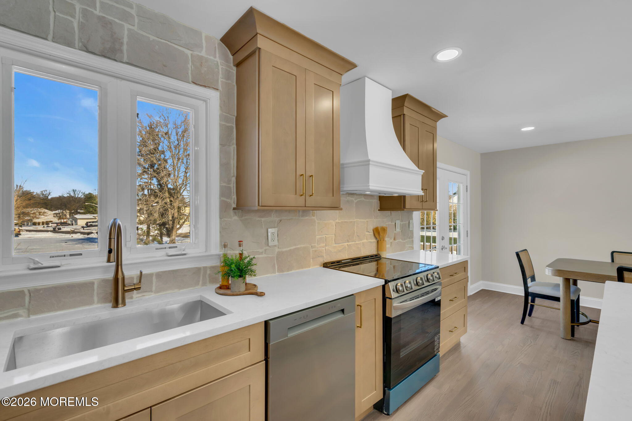 568 Flock Road Hamilton Square, NJ 08690 - Photo 62 of 65 a kitchen with stainless steel appliances granite countertop a sink a stove and a wooden cabinets