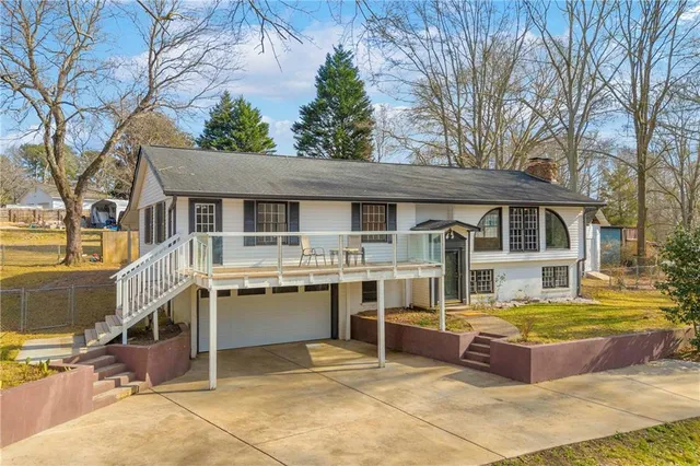 a view of house with outdoor seating area