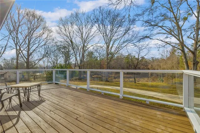 a view of a wooden deck with a bench