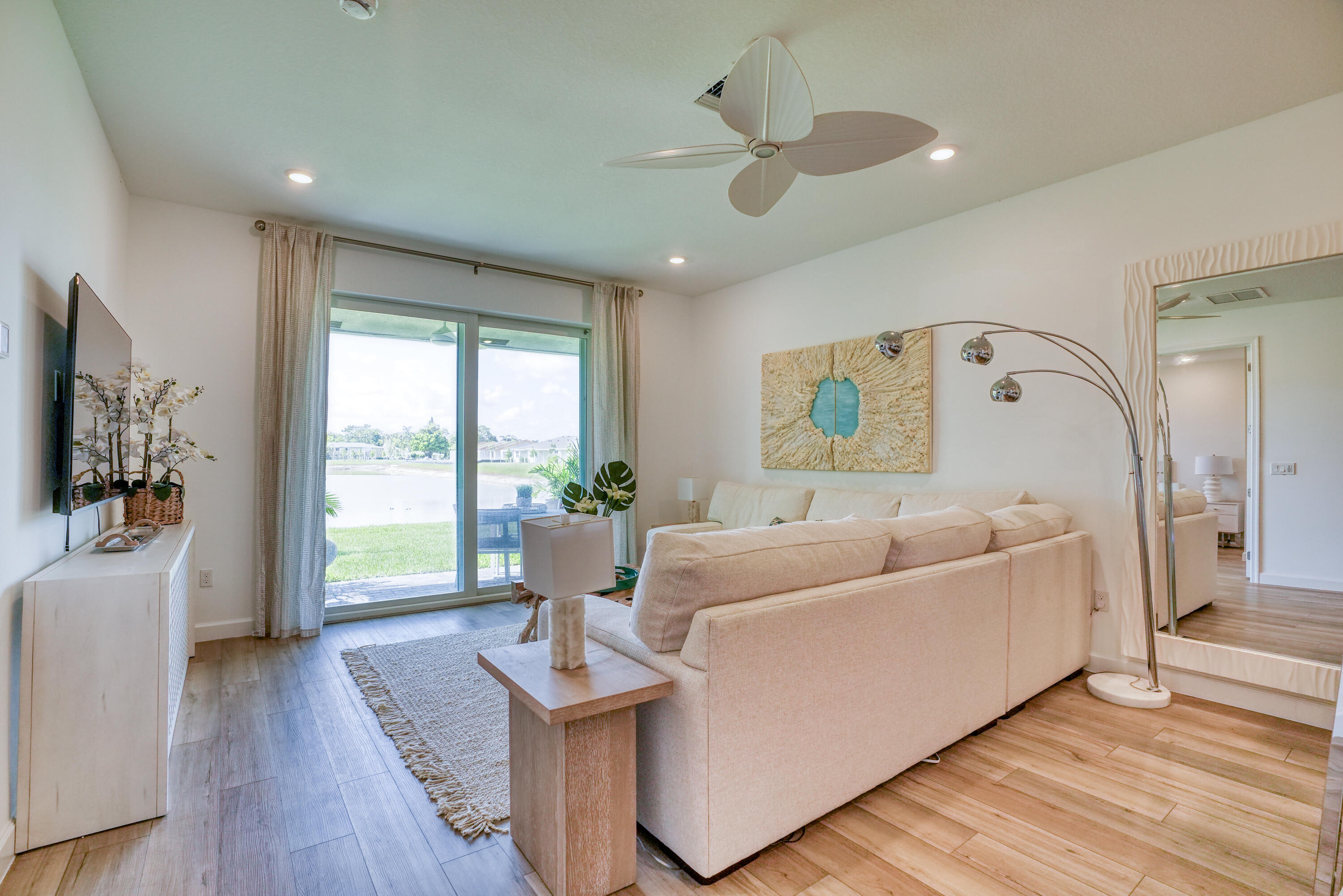 13776 Hero Path Delray Beach, FL 33484 - Photo 4 of 13 a living room with furniture and a flat screen tv