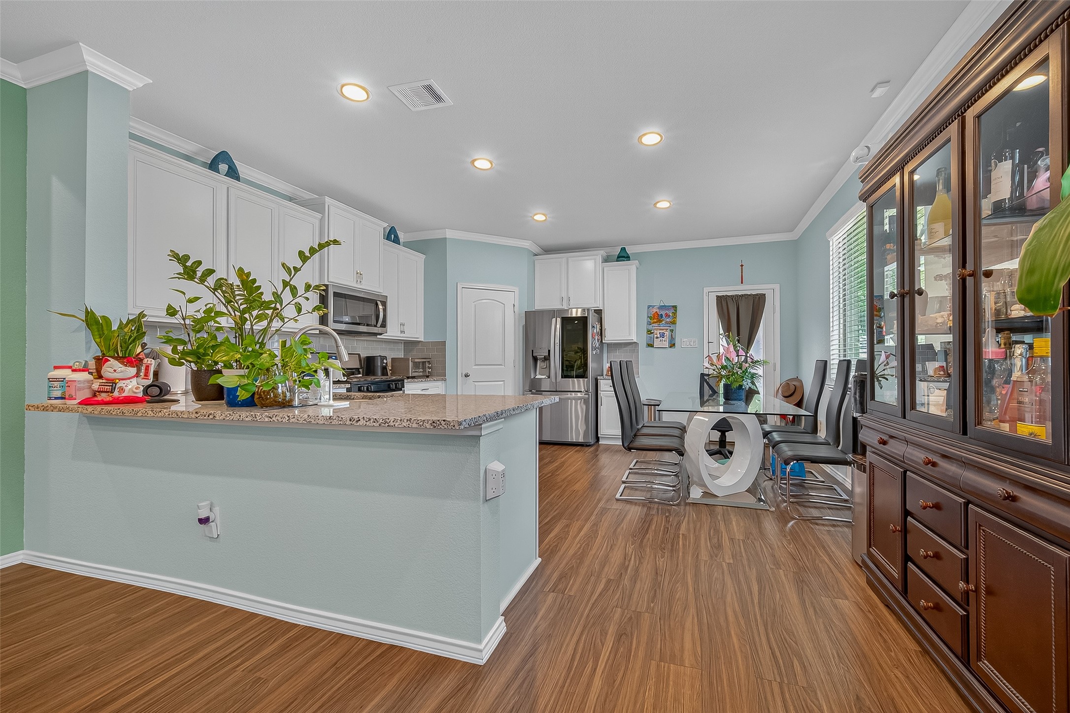 9253 Inland Leather Lane Conroe, TX 77385 - Photo 11 of 34 a living room with furniture and a wooden floor
