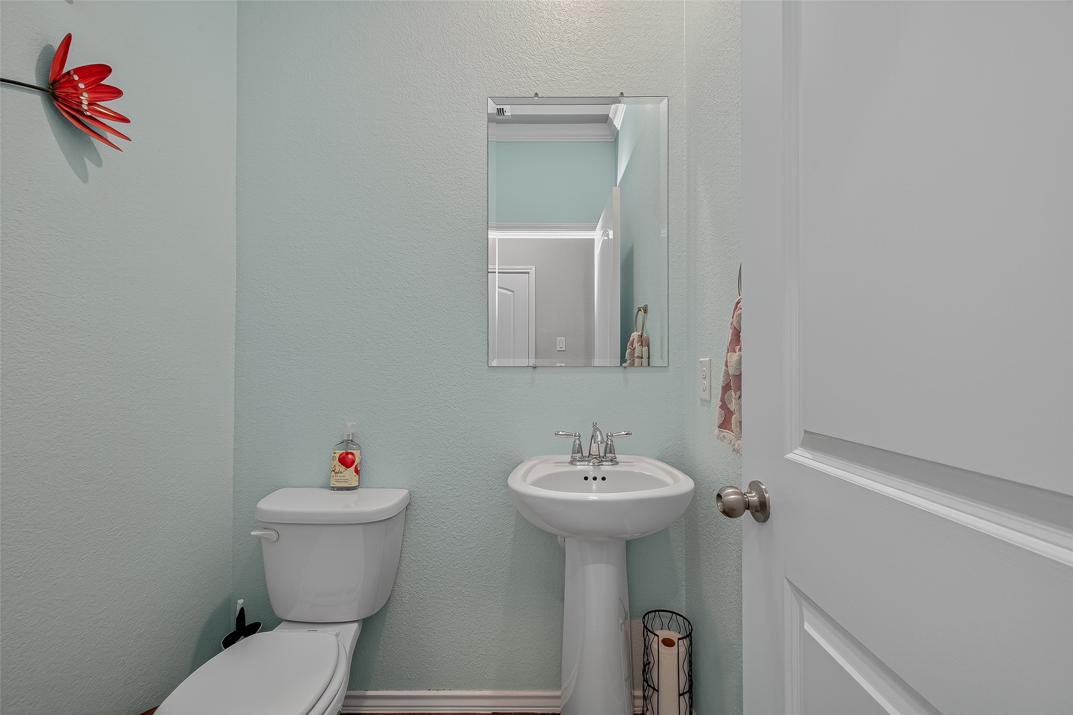 9253 Inland Leather Lane Conroe, TX 77385 - Photo 12 of 34 a bathroom with a sink and a toilet