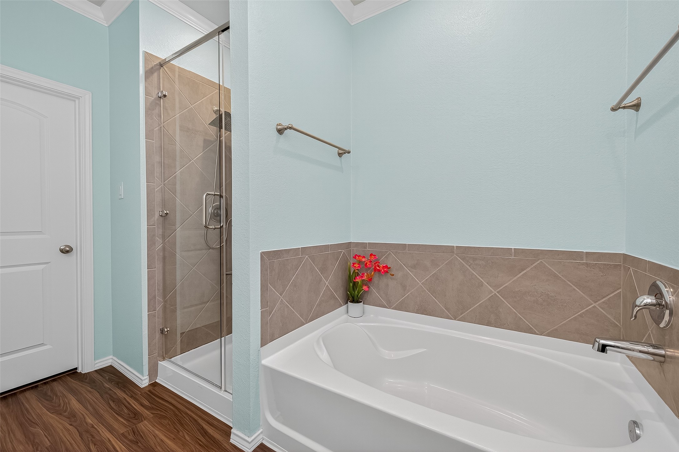 9253 Inland Leather Lane Conroe, TX 77385 - Photo 23 of 34 a bathroom with a tub and shower