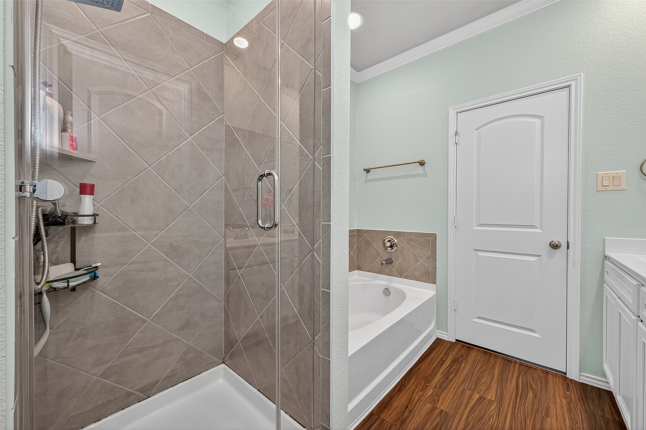 9253 Inland Leather Lane Conroe, TX 77385 - Photo 24 of 34 a bathroom with a bathtub and shower