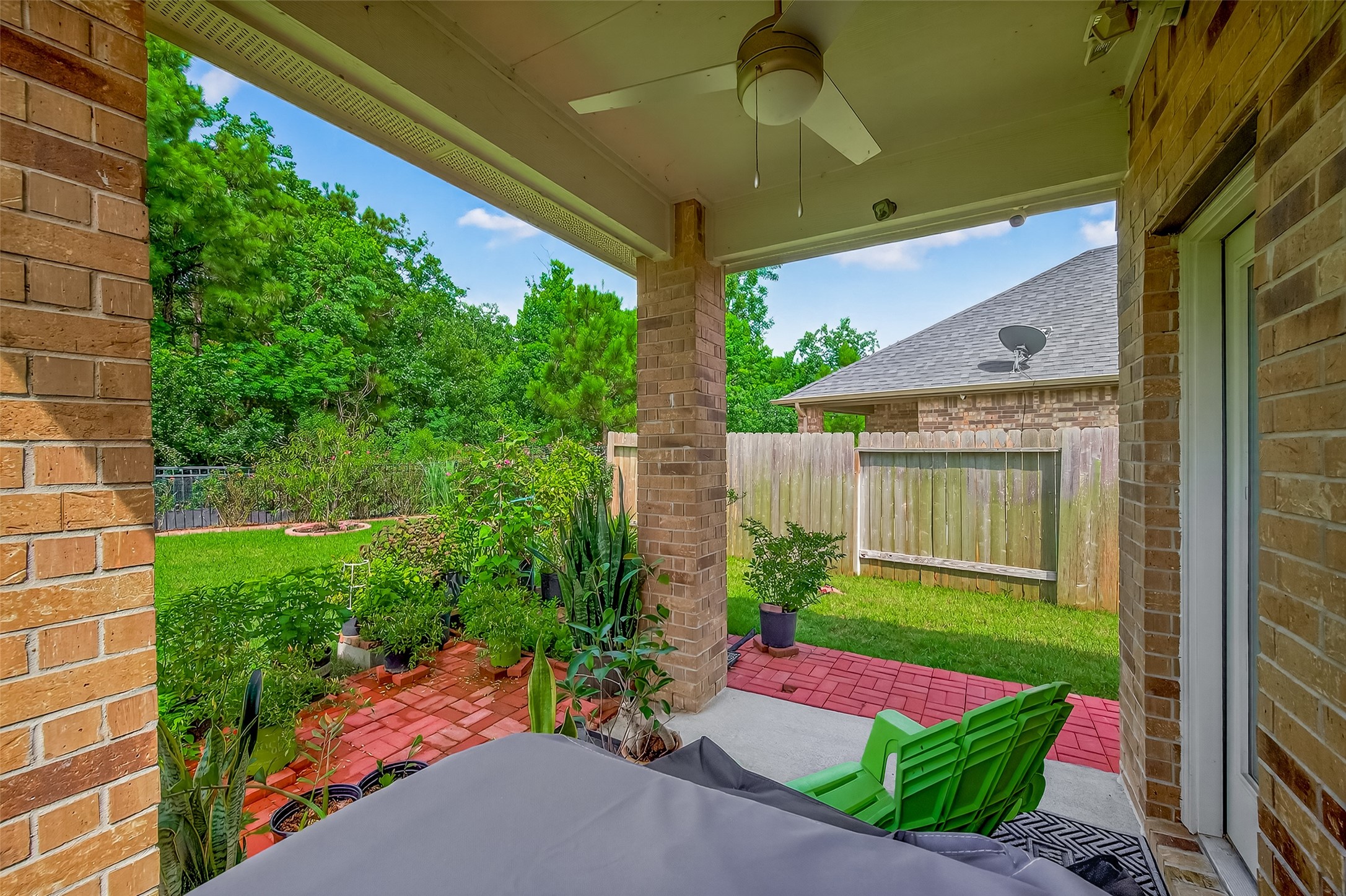 9253 Inland Leather Lane Conroe, TX 77385 - Photo 26 of 34 a garden view with a seating space