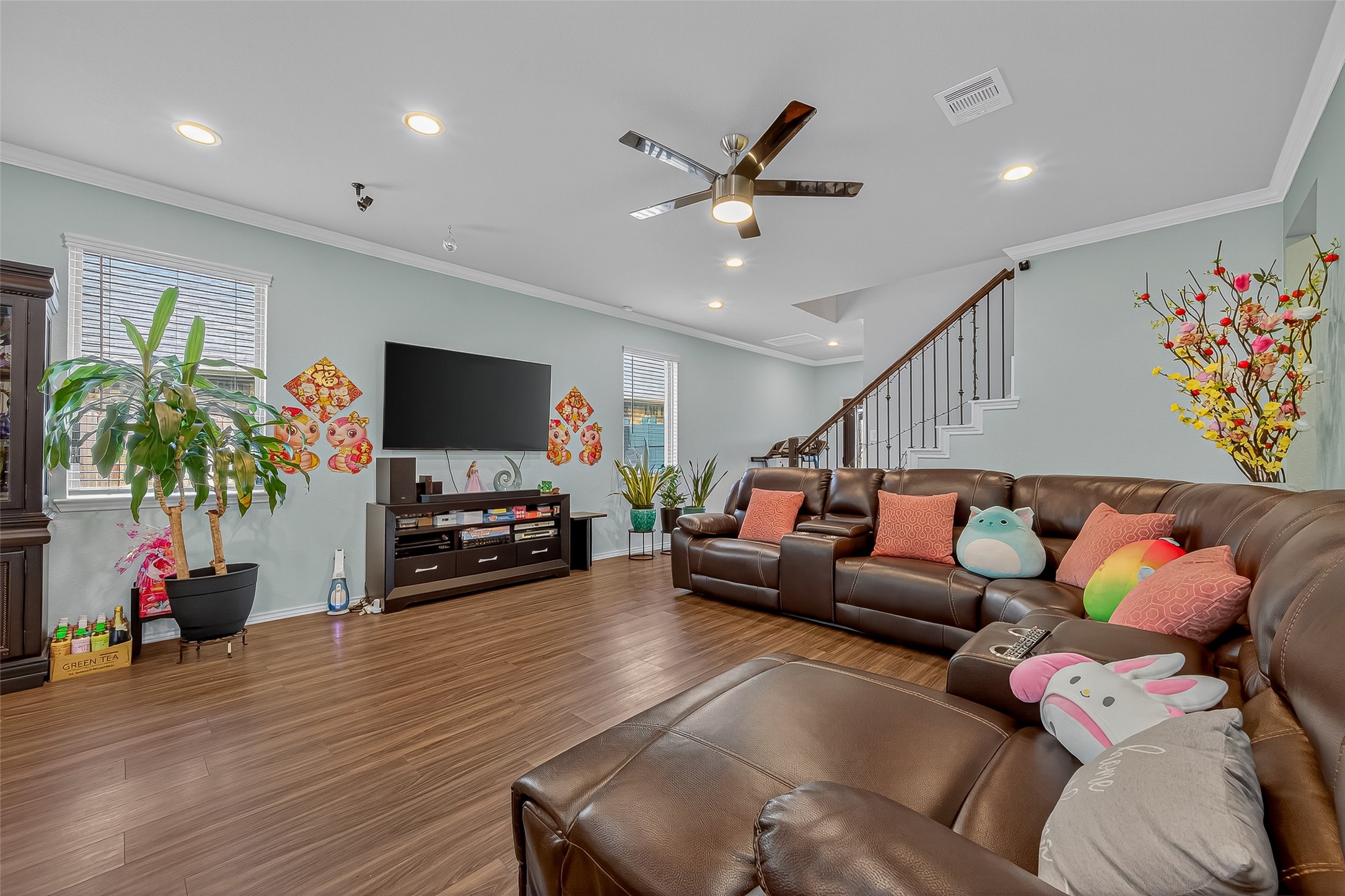 9253 Inland Leather Lane Conroe, TX 77385 - Photo 5 of 34 a living room with furniture and a flat screen tv